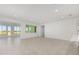 Bright living room with tile floors and view of backyard at 8497 Sw 99Th Cir, Ocala, FL 34481