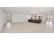 Spacious living area with tile floors, and an open layout connected to the kitchen at 8497 Sw 99Th Cir, Ocala, FL 34481