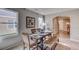 Bright dining room featuring a rustic wooden table with seating for six and natural light at 8626 Sw 44Th Ter, Ocala, FL 34476