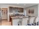 Open kitchen showcasing granite countertops, a pantry, stainless steel appliances, and a breakfast bar at 8626 Sw 44Th Ter, Ocala, FL 34476