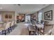 Spacious living area with an open concept design, seamlessly connecting to the kitchen and dining area at 8626 Sw 44Th Ter, Ocala, FL 34476