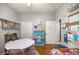 bedroom featuring storage, wood floors, and white trim at 8630 Sw 20Th Ct, Ocala, FL 34476