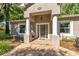 Inviting front porch with classic columns and decorative details at 8630 Sw 20Th Ct, Ocala, FL 34476