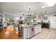 Open kitchen featuring a large island, modern appliances, and connection to the living space at 8630 Sw 20Th Ct, Ocala, FL 34476