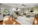 Inviting living room featuring a fireplace, hardwood floors, and comfortable seating at 8630 Sw 20Th Ct, Ocala, FL 34476