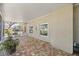 This patio features a brick floor and neutral tones at 8630 Sw 20Th Ct, Ocala, FL 34476