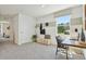 Bright, carpeted bedroom with a large window, modern decor, and ample natural light at 8632 Sw 44Th Ter, Ocala, FL 34476