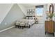 Cozy bedroom with a geometric accent wall, a comfortable bed and stylish decorations at 8632 Sw 44Th Ter, Ocala, FL 34476