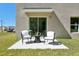 Cozy outdoor patio area with seating, perfect for relaxing and enjoying the fresh air in a private backyard at 8632 Sw 44Th Ter, Ocala, FL 34476