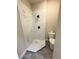 Modern bathroom boasts a marble tiled shower, new vanity, and sleek fixtures at 910 Ne 11Th Ave, Ocala, FL 34470