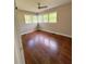 Bright bedroom with hardwood floors, neutral paint, and large windows providing ample natural light at 910 Ne 11Th Ave, Ocala, FL 34470