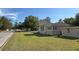 A cozy house with stylish architecture, trimmed windows, and a well-maintained lawn at 910 Ne 11Th Ave, Ocala, FL 34470