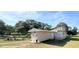 Charming single-story home with unique architectural details, and green trees at 910 Ne 11Th Ave, Ocala, FL 34470