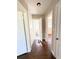 Inviting hallway with hardwood floors leads to bathroom and bedroom at 910 Ne 11Th Ave, Ocala, FL 34470