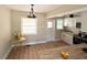 Updated kitchen featuring butcher block counters, stainless steel appliances, and a dining area at 910 Ne 11Th Ave, Ocala, FL 34470