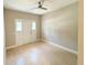 Spacious living room boasts neutral paint and tile flooring at 910 Ne 11Th Ave, Ocala, FL 34470