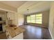 Sunlit living room area with large windows, neutral paint, and a butcher block counter at 910 Ne 11Th Ave, Ocala, FL 34470