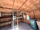 Interior view of the wooden shed with shelving and waste bins at 910 Ne 11Th Ave, Ocala, FL 34470