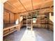 Interior view of the wooden shed with shelving at 910 Ne 11Th Ave, Ocala, FL 34470