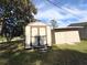 View of new backyard storage shed and adjacent shed with a bright blue sky overhead at 910 Ne 11Th Ave, Ocala, FL 34470