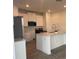 Bright kitchen featuring white cabinetry, modern appliances, and an island at 9326 Sw 57Th Ter, Ocala, FL 34476