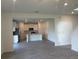 Open-concept living space with modern tile flooring leading to the kitchen at 9326 Sw 57Th Ter, Ocala, FL 34476