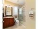 Bathroom featuring a vanity, toilet and glass-enclosed shower at 9443 Sw 71St Loop, Ocala, FL 34481