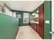 Bathroom featuring tile floors, walk-in shower, and double vanity at 9443 Sw 71St Loop, Ocala, FL 34481