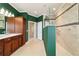 Bathroom featuring tile floors, walk-in shower, and vanity at 9443 Sw 71St Loop, Ocala, FL 34481