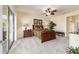 Bedroom featuring a ceiling fan, and sliding glass doors to a screened patio at 9443 Sw 71St Loop, Ocala, FL 34481