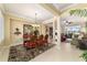 Bright dining room with tile floors, chandelier lighting, flowing into the living area overlooking the golf course at 9443 Sw 71St Loop, Ocala, FL 34481