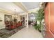 Open-concept dining room with tile floors, stylish chandelier, and seamless flow to living area at 9443 Sw 71St Loop, Ocala, FL 34481