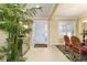 Inviting dining area featuring tile floors, shutters, and open layout, adjacent to a palm tree at 9443 Sw 71St Loop, Ocala, FL 34481