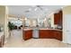 Bright kitchen featuring wood cabinets, stainless steel appliances, and an open floorplan at 9443 Sw 71St Loop, Ocala, FL 34481