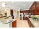 Spacious kitchen with stainless appliances, ample cabinet space, and an eat-in bar area at 9443 Sw 71St Loop, Ocala, FL 34481