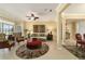 Inviting living room with neutral tones, ceiling fan, and elegant furnishings, perfect for relaxing and entertaining guests at 9443 Sw 71St Loop, Ocala, FL 34481
