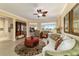 Cozy living room featuring tile floors, stylish furnishings, and a view of the lush golf course at 9443 Sw 71St Loop, Ocala, FL 34481