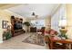 Bright living room featuring large windows, plantation shutters, and a cozy seating arrangement at 9443 Sw 71St Loop, Ocala, FL 34481
