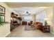 Bright and airy living room with plantation shutters, wood flooring, and classic furnishings, creating a cozy atmosphere at 9443 Sw 71St Loop, Ocala, FL 34481