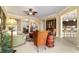 Spacious living room with an open layout, showcasing natural light and connection to other living spaces at 9443 Sw 71St Loop, Ocala, FL 34481
