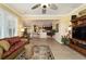 Open-concept living room with views into kitchen, stylish furnishings, and decorative rug at 9443 Sw 71St Loop, Ocala, FL 34481
