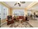 Comfortable living room featuring natural light, cozy seating, and an open floor plan at 9443 Sw 71St Loop, Ocala, FL 34481