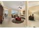 Bright living room with tile floors, ceiling fan, and golf course views at 9443 Sw 71St Loop, Ocala, FL 34481