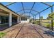 Spacious screened-in patio features an outdoor fountain and views of the lush green lawn at 9443 Sw 71St Loop, Ocala, FL 34481