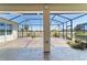 Spacious screened patio with decorative concrete floors and tranquil golf course views beyond at 9443 Sw 71St Loop, Ocala, FL 34481