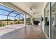 Relaxing screened patio offering a lovely outdoor space with golf course views and ceiling fans at 9443 Sw 71St Loop, Ocala, FL 34481
