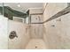 Custom tiled walk-in shower featuring an adjustable showerhead and built-in niche at 9443 Sw 71St Loop, Ocala, FL 34481