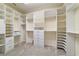 Spacious walk-in closet with custom built-in shelving and multiple hanging rods at 9443 Sw 71St Loop, Ocala, FL 34481