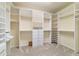 Large walk-in closet with organizers, shelves, drawers, and hanging spaces at 9443 Sw 71St Loop, Ocala, FL 34481