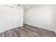 Clean bedroom features wood floors and a closet, offering a simple and functional living space at 9973 Sw 107Th Ter, Ocala, FL 34481